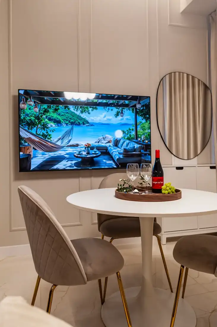 Dining table under full-height windows