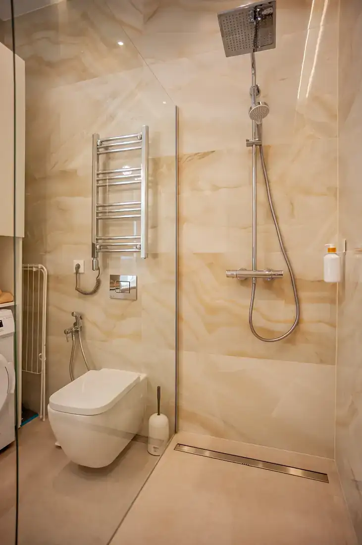 Rain shower behind a glass screen