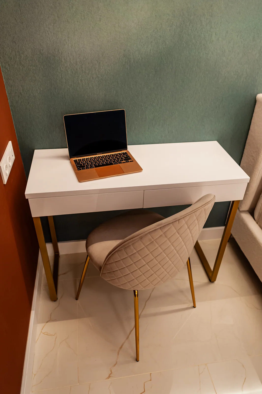 Desk on the green wall