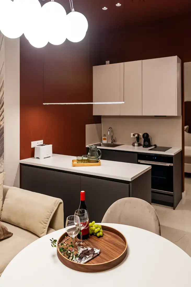 Kitchen island under cloud pendant lights